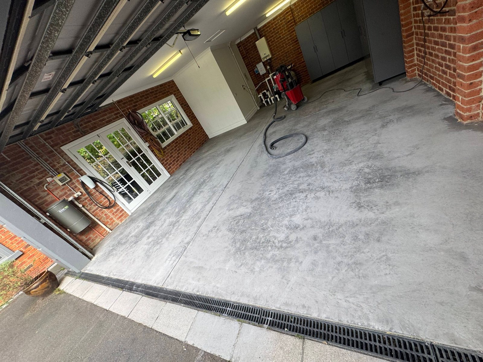 Before epoxy garage resurfacing in Melbourne — stained and cracked concrete floor needing restoration.
