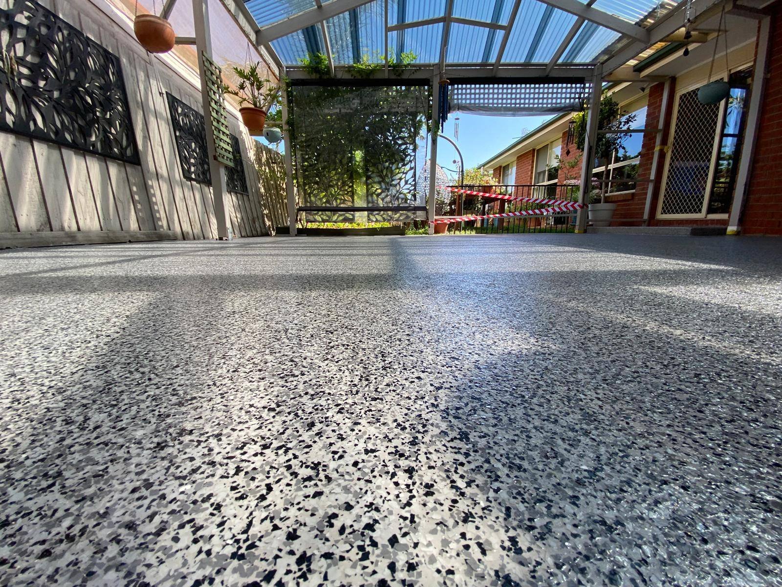 Epoxy patio installation in Melbourne with durable and stylish outdoor flooring finish