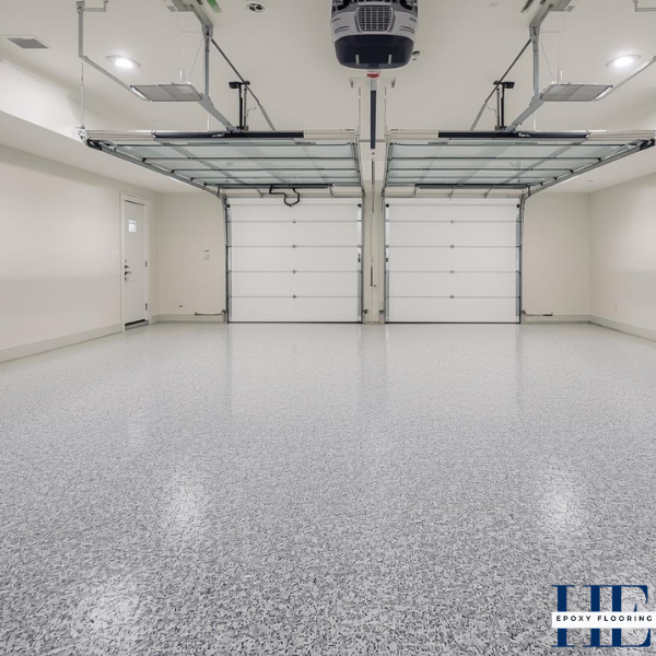 Wide shot of a clean, finished large double garage in a Caroline Springs home with flake epoxy.