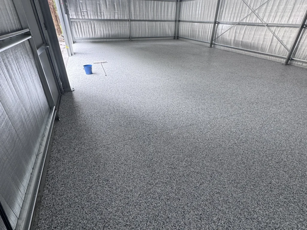 Epoxy flake floor in a large steel shed in St Albans installed by Highend Epoxy Flooring