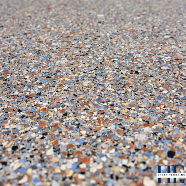 Close-up detail of non-slip decorative flake epoxy floor texture.