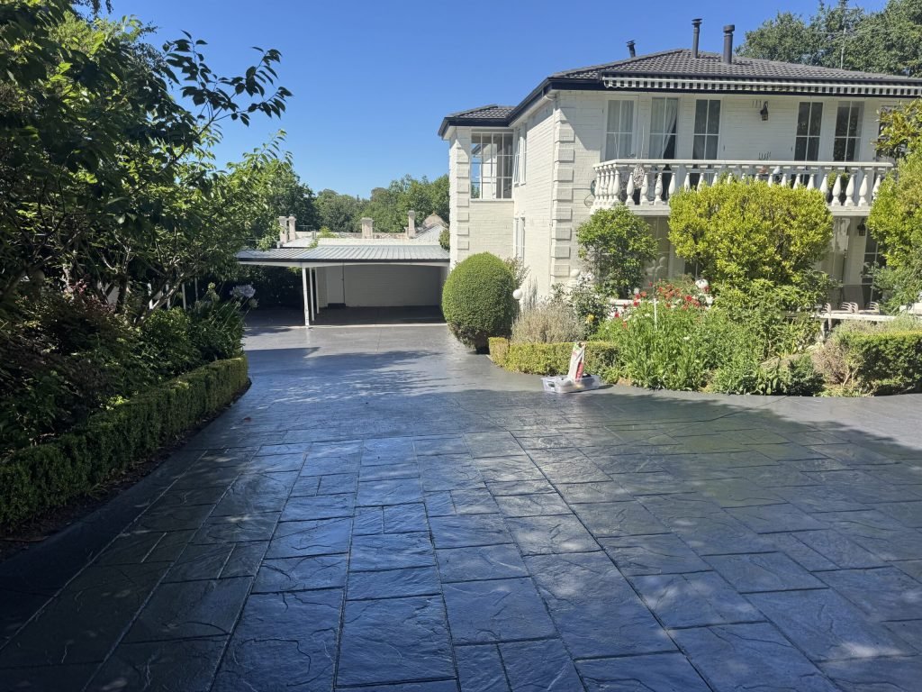 Professional epoxy flake driveway coating installed at a Melbourne home with a seamless, durable, and decorative finish.