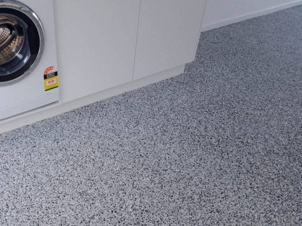 Seamless epoxy floor in a Melbourne laundry room – moisture-resistant and easy to clean with a modern finish.